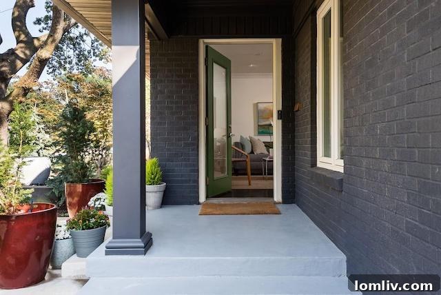 4160 Lively Lane, a beautifully renovated home in Midway Hollow, Dallas, featuring a striking black brick exterior.