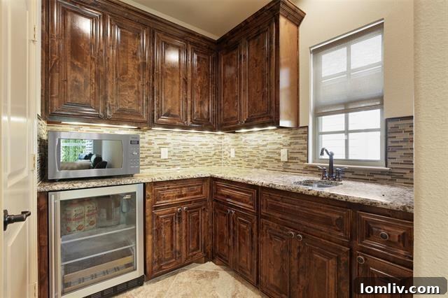 Versatile upstairs game room featuring a stylish wet bar, perfect for entertaining