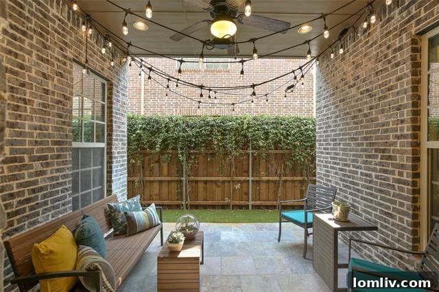 Cozy covered patio area with outdoor seating, ideal for relaxation