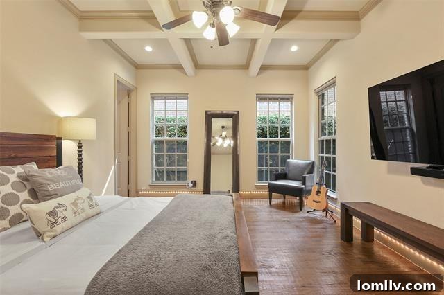 Luxurious primary bedroom with ample natural light and modern design