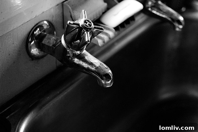 Close-up of a household tap, symbolizing water systems and maintenance in a home.