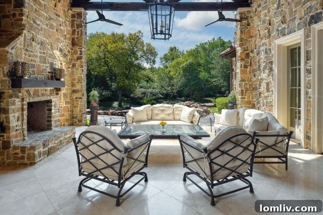Luxurious outdoor fireplace on a stone patio, creating a cozy and inviting atmosphere