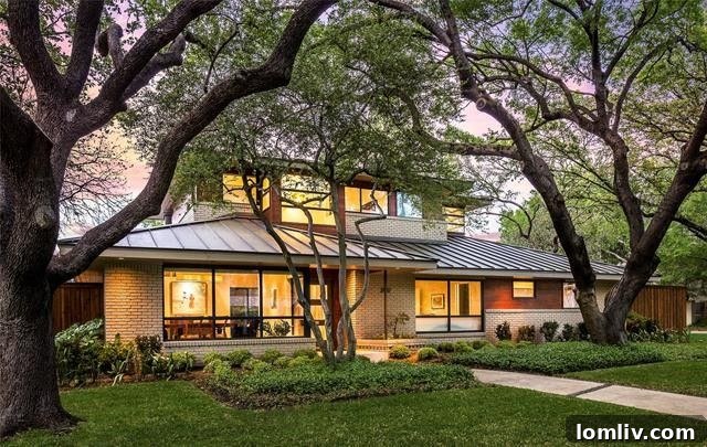 A stunning modern exterior of a luxury Dallas home, featuring clean lines and lush landscaping.