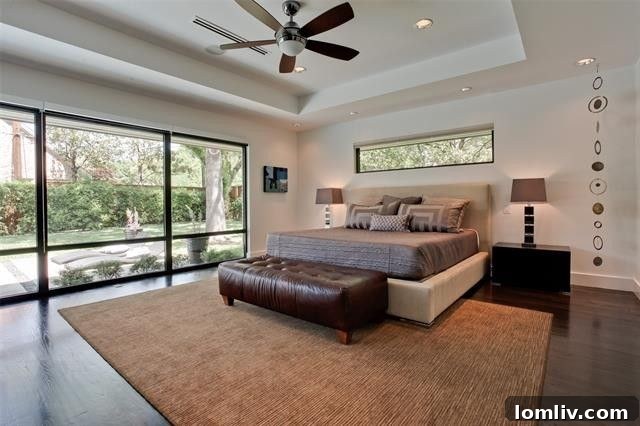 The luxurious owner's suite with direct access to the outdoor pool area.
