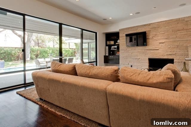 The modern, open living area after the extensive makeover, showcasing fluidity and light.