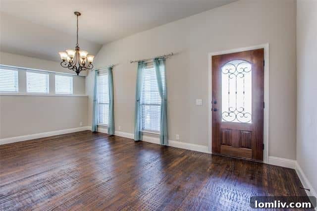 Spacious open-concept living area with hardwood floors