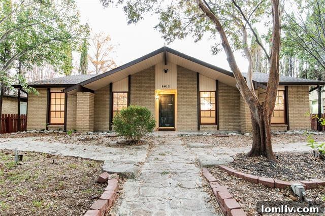 Cozy single-story home exterior with covered porch and well-maintained landscaping