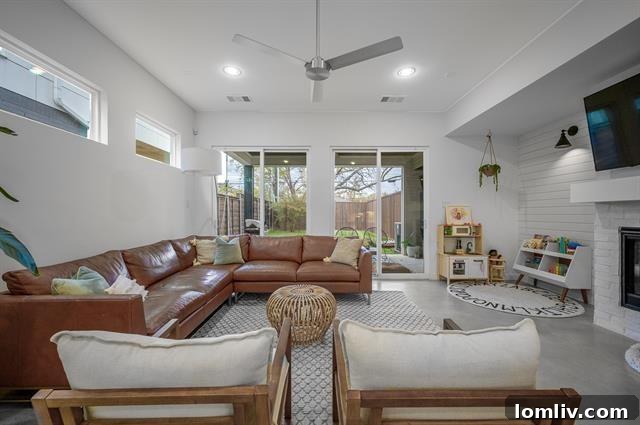 Inviting family room with a modern fireplace, offering a cozy yet stylish retreat within the home.