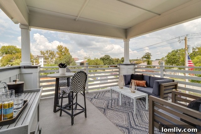 Covered third-floor patio with panoramic views of Fort Worth from Edgewater homes