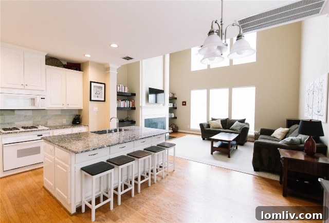 Fort Worth Townhome: Your Ticket to Panther Island Pavilion 5 Inviting kitchen and family room in the townhome, featuring a cozy fireplace and large windows