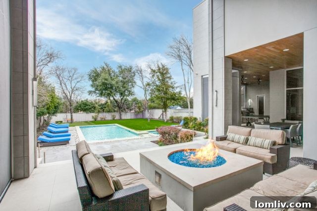 Luxury exterior of 6517 Dykes Way Dallas TX with serene blue sky