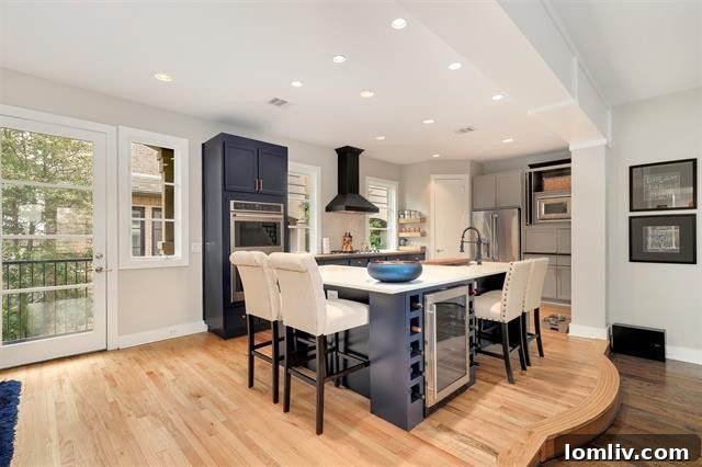 Open-plan living and kitchen area showcasing seamless design and ample natural light in a Dallas townhome