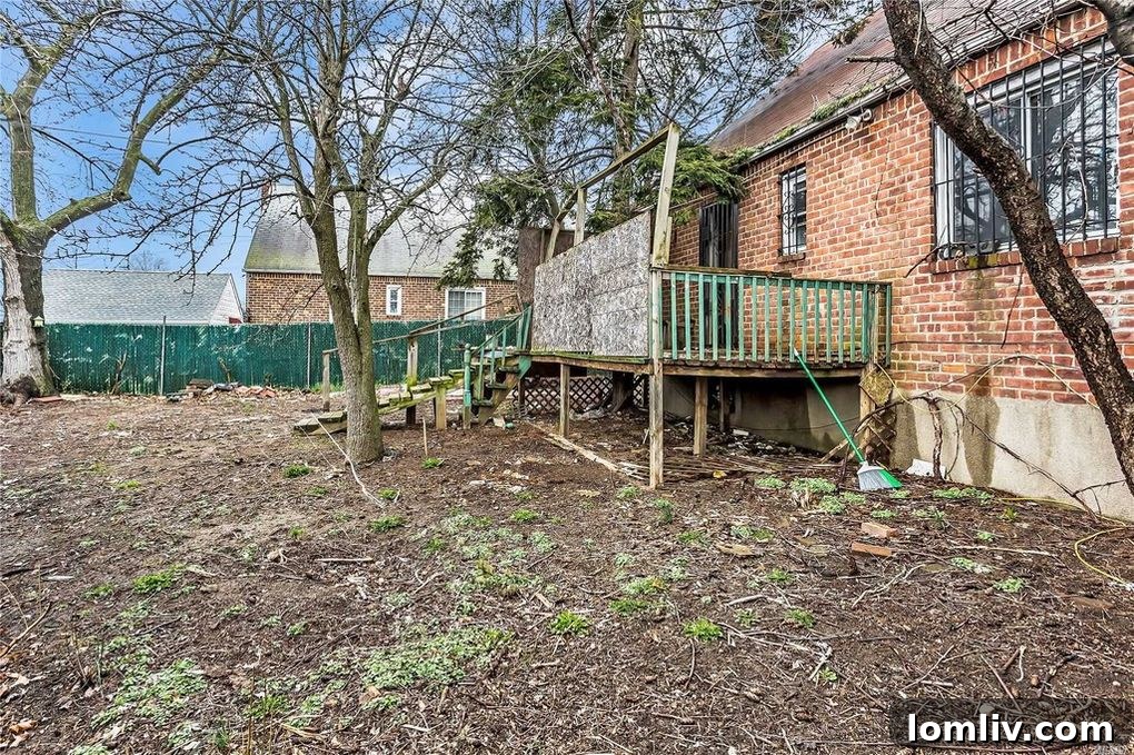 Another perspective of the severely overgrown and neglected backyard