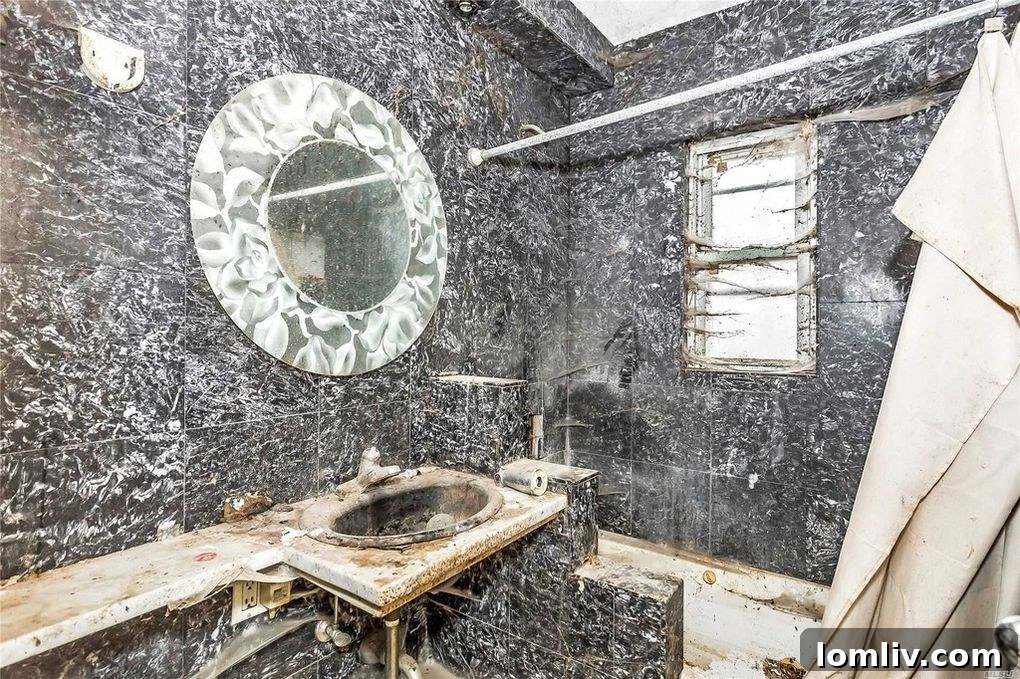 Another severely damaged interior space, possibly a former living area or bedroom