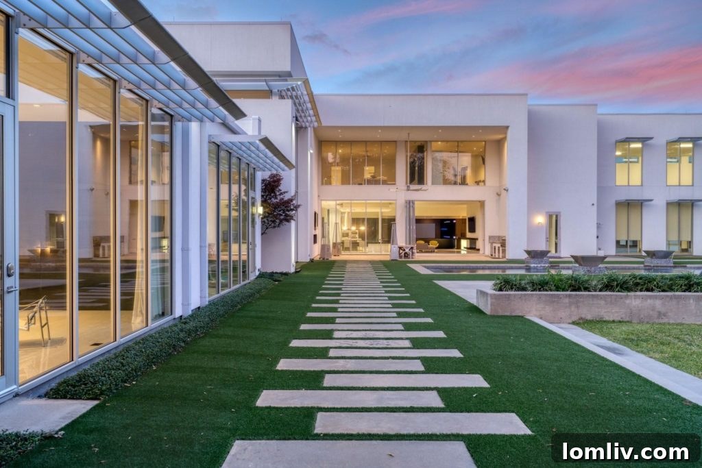 Aerial view of the 10106 Inwood Road property with surrounding greenery