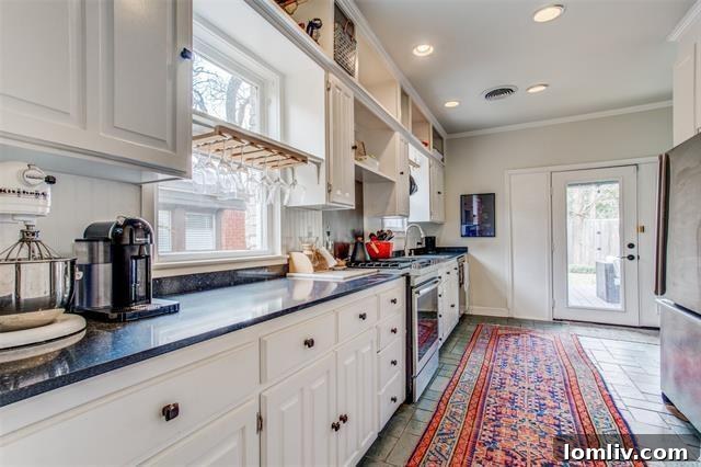 Discover Your New Year's Home: East Dallas Open House Debut 13 Inviting backyard deck perfect for entertaining and outdoor relaxation
