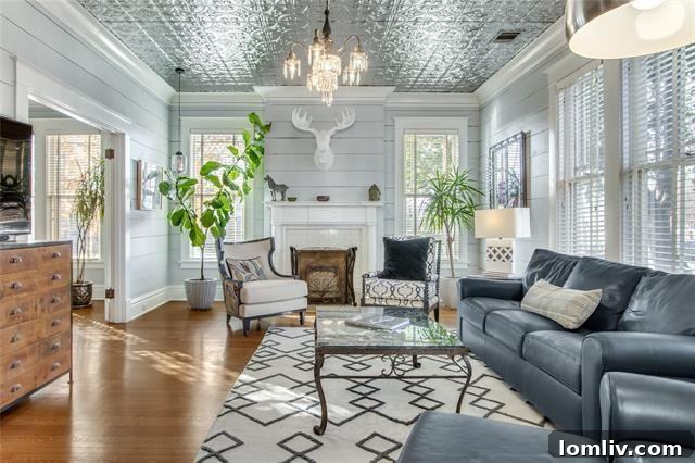 Discover Your New Year's Home: East Dallas Open House Debut 7 Cozy living room with original fireplace and hardwood floors in Craftsman home