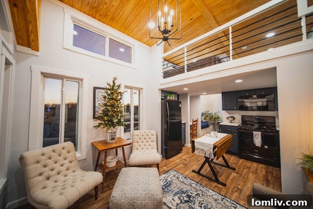 Cowtown Cottages: Tiny Homes, Massive Solutions 6 Elevated ceilings with wood paneling in Cowtown Cottages create an elegant and spacious feel.