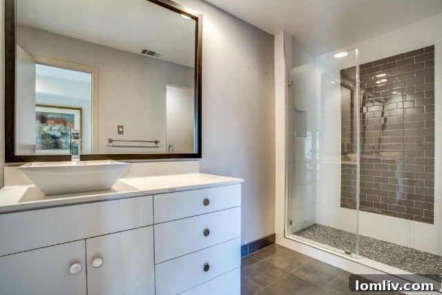 Upstairs bedroom with newly installed wood floors, ample natural light, and tasteful decor