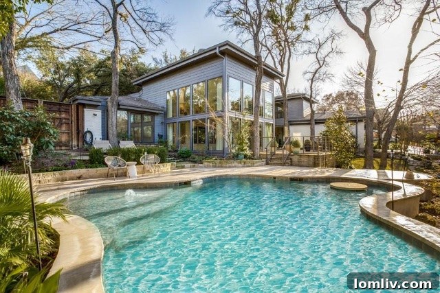 Inviting patio area overlooking the stunning pool and meticulously designed garden