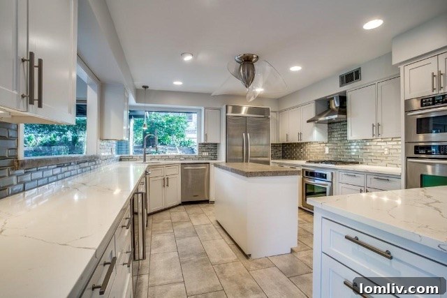 Spacious kitchen design with subway tile backsplash and modern appliances
