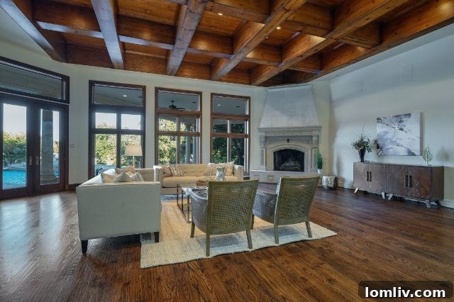A stunning view of the opulent master bedroom suite with seating area.