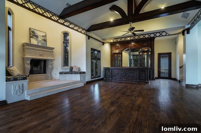 Spacious recreation room featuring a billiard table and elegant seating.