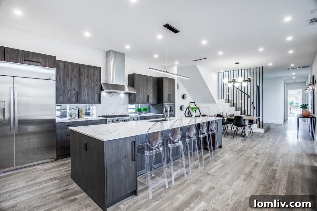 High-tech open-plan kitchen with modern appliances and island