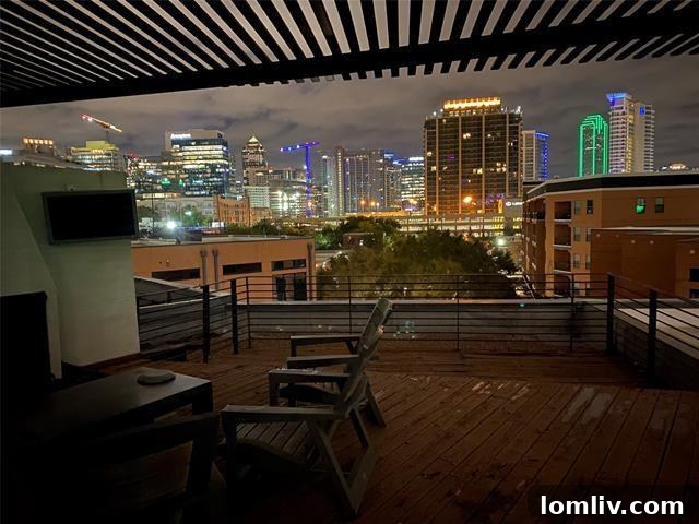Three-Story Haven Where Only The Views Reign Supreme 14 Exclusive private rooftop terrace offering panoramic Dallas skyline views