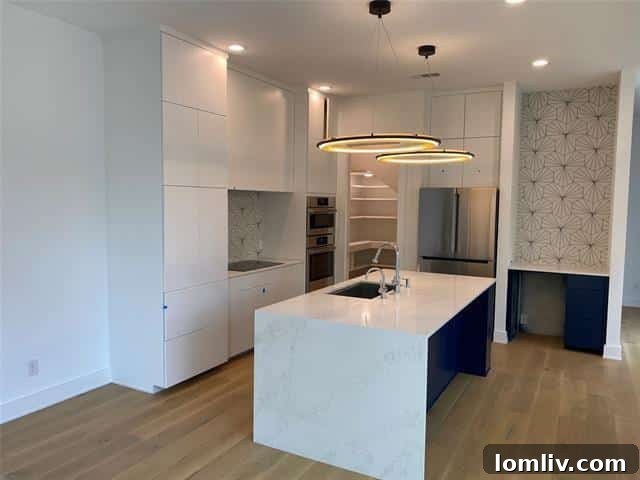 Contemporary Kitchen with Waterfall Quartz in Dallas Duplex