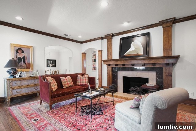 Welcoming fireplace in the foyer of 313 North Bailey Drive, providing an immediate sense of warmth upon entering the home.