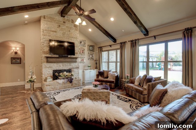 Magnificent fireplace in the open-concept family room of 5216 Sendero Drive, seamlessly connecting to the kitchen and dining areas.