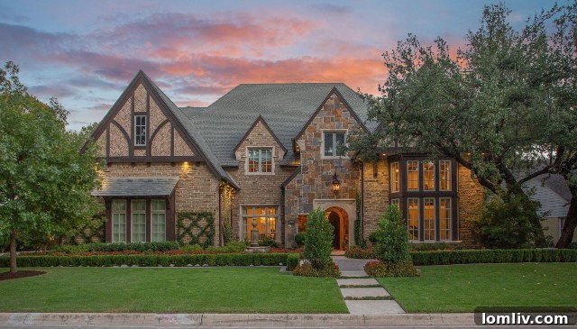 Elegant English Tudor home at 2925 Owenwood Drive featuring multiple fireplaces both inside and outside, perfect for keeping warm. Photos by Trey Freeze Media.
