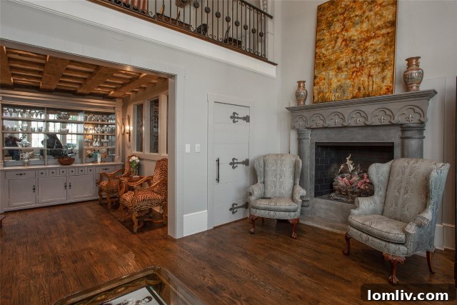 Charming fireplace illuminating the entrance to a luxurious walk-in wine cellar at 2925 Owenwood Drive, perfect for connoisseurs.