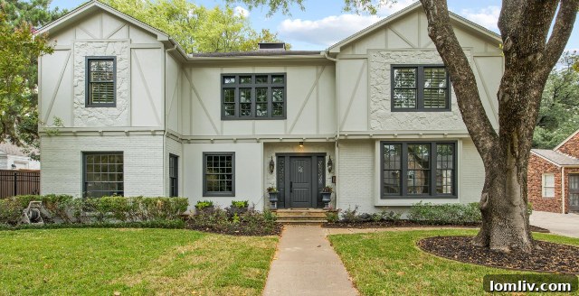 Charming facade of the secluded home at 313 North Bailey in the Crestwood neighborhood, surrounded by mature trees. Photos by Norman & Young.