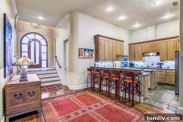 Discover the remodeled kitchen at 1311 Waterside Drive, featuring an artistic ceramic mosaic backsplash.