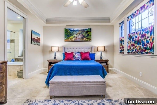 The primary bedroom downstairs offers a private retreat in this thoughtfully designed Forest Hills home.