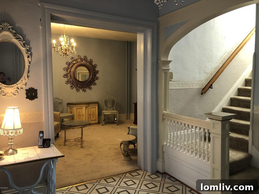 Classic Victorian Living Room with Fireplace and Arch Details