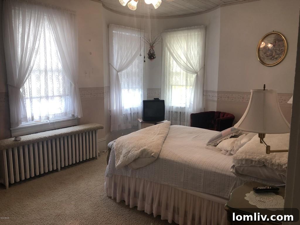 Victorian Bedroom with Multiple Dolls Displayed