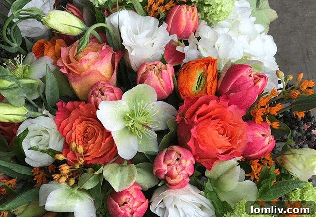 Spring bouquet featuring hellebores, roses, hydrangea, and Columbus tulips