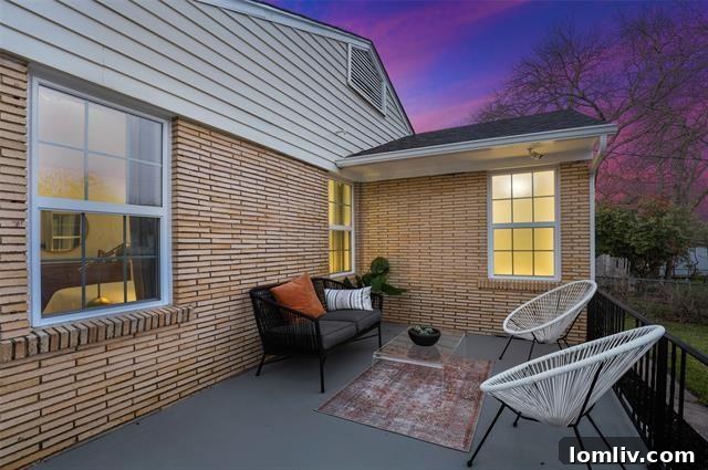 A spacious outdoor deck overlooking an expansive backyard, ideal for relaxation, entertaining, and enjoying the Dallas climate.