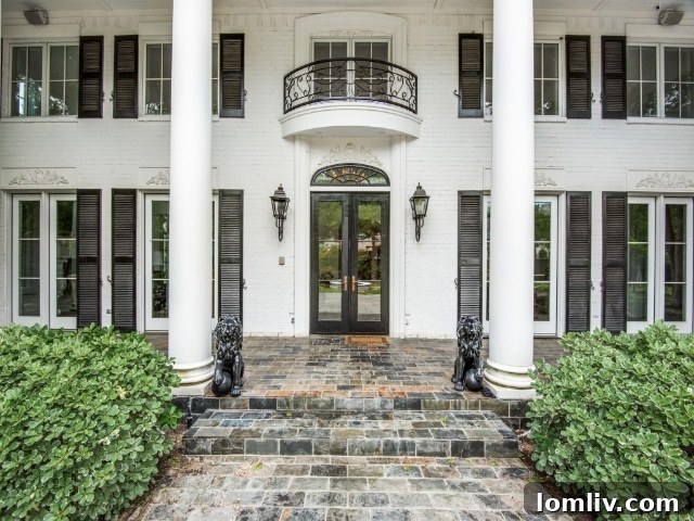 Majestic entrance of a Preston Hollow Colonial Revival home