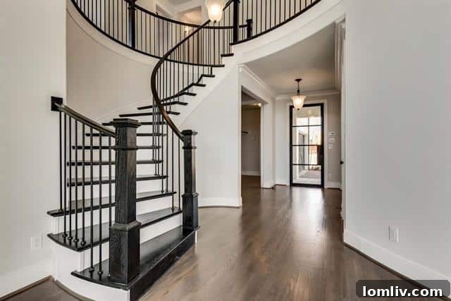 Elegant interior living space of a Frisco luxury home with high ceilings, hardwood floors, and abundant natural light.
