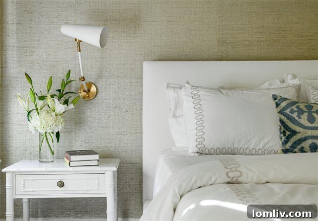 Bright bedroom showcasing refinished hardwood floors and ample natural light.