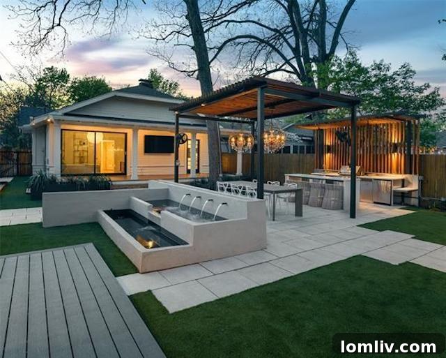 Expansive and luxurious backyard oasis with an outdoor kitchen, bar, and custom landscaping.