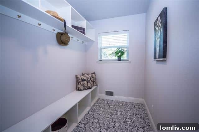 Stylish and functional mudroom with built-in cubbies and bench seating, ideal for organization.