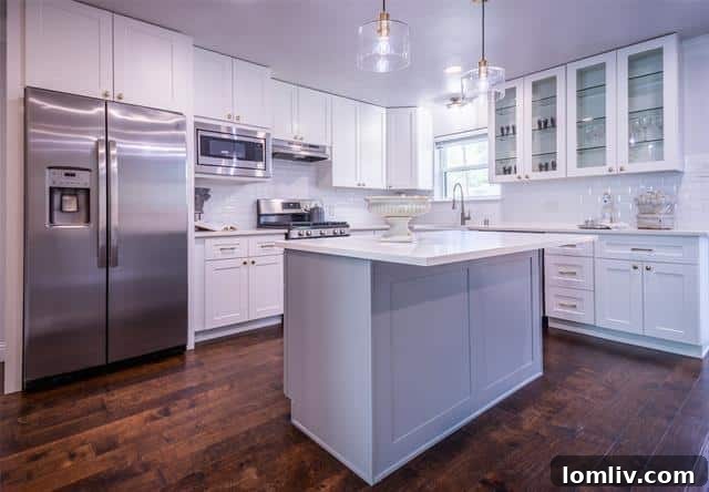 Spacious bedroom with a walk-in closet, ample natural light, and hardwood flooring.