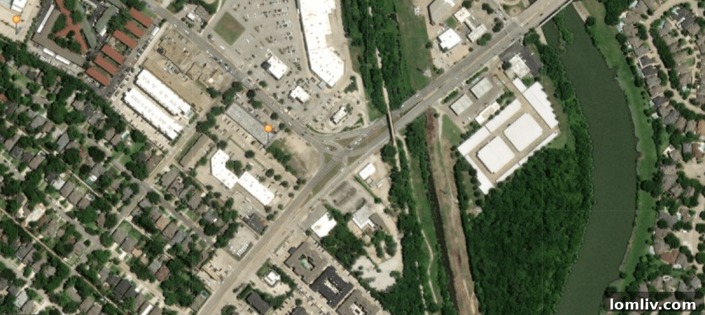 Architectural rendering of the proposed Mill Creek Trailhead development near the Garland-Grand-Gaston Intersection, showcasing a multi-story building alongside the Santa Fe Trail.