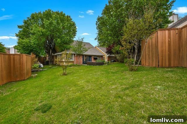 Bright, Bold, and Beautiful: This North Dallas Gem Features Soaring Ceilings, Abundant Light, and Distinctive Architecture 3 Expansive Brick Patio and Verdant Lawn in North Dallas Backyard