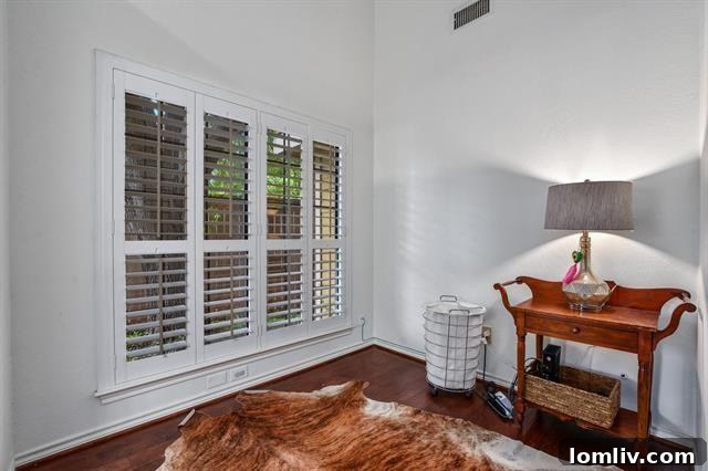 Bright, Bold, and Beautiful: This North Dallas Gem Features Soaring Ceilings, Abundant Light, and Distinctive Architecture 6 Modern Chandelier Illuminating a Stylish Dining Room
